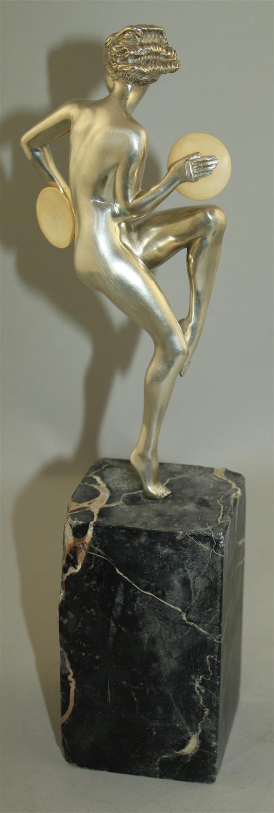 An Art Deco silvered bronze figure of a nude female dancer, overall 12.5in.